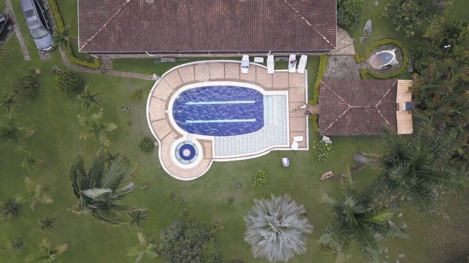 Night-lit pool from above ??? luxury Colombian estate